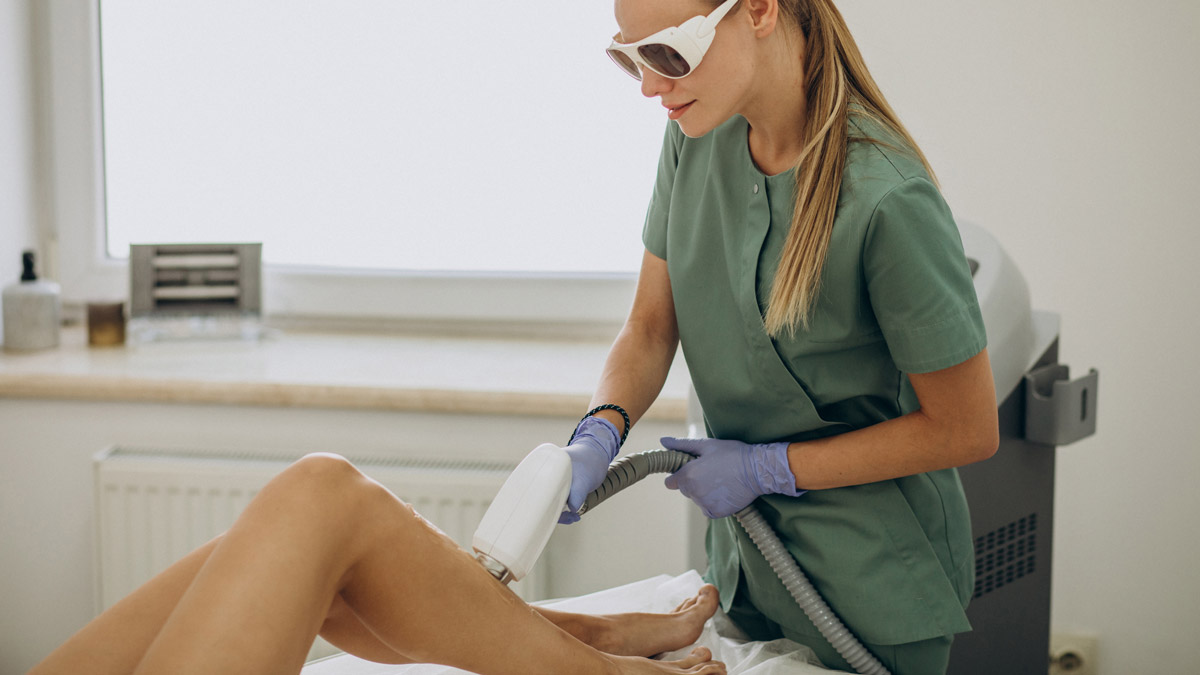 Laser hair removal on legs by female operator