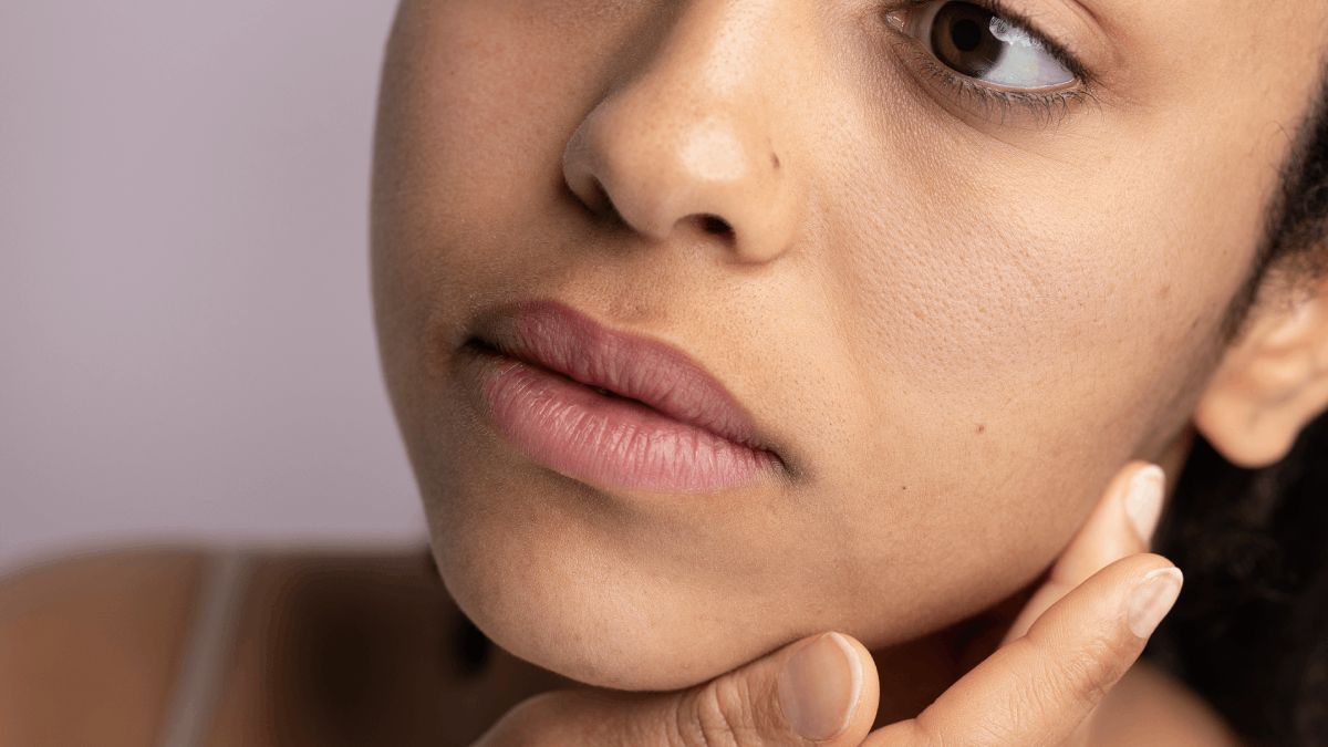 Closeup woman's skin pores on face