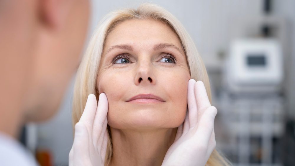 Close-up doctor checking smiley woman face