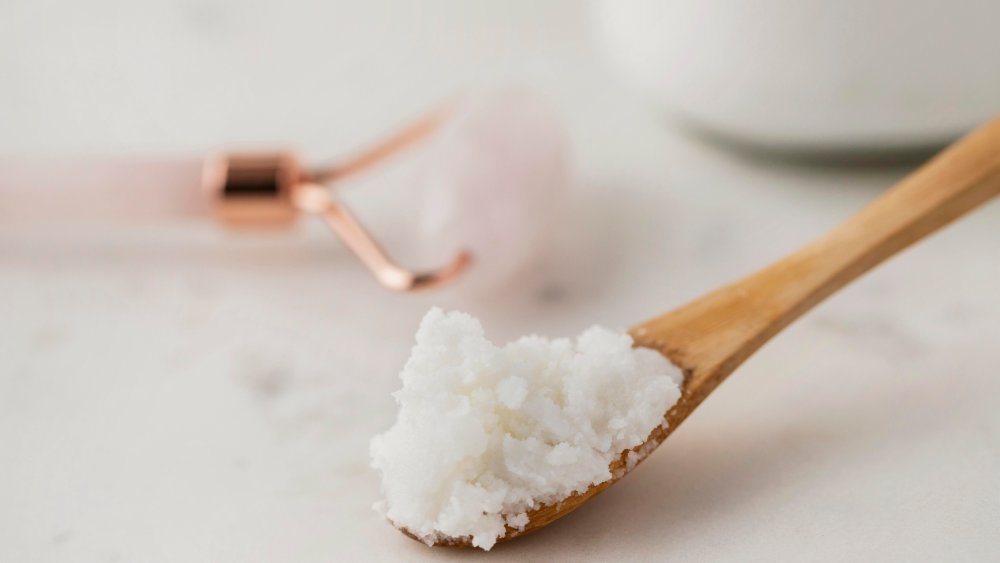 Closeup of a spoon of salt as exfoliant