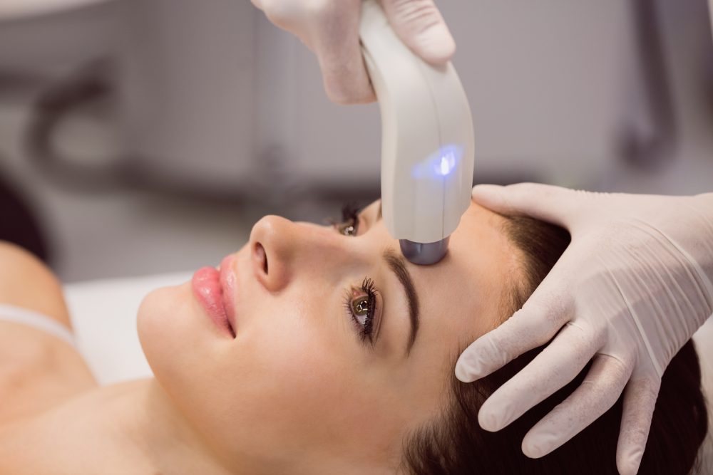 Female patient receiving cosmetic treatment