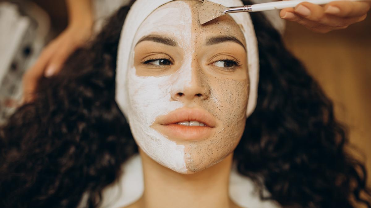 Woman in skincare clinic doing skin exfoliation