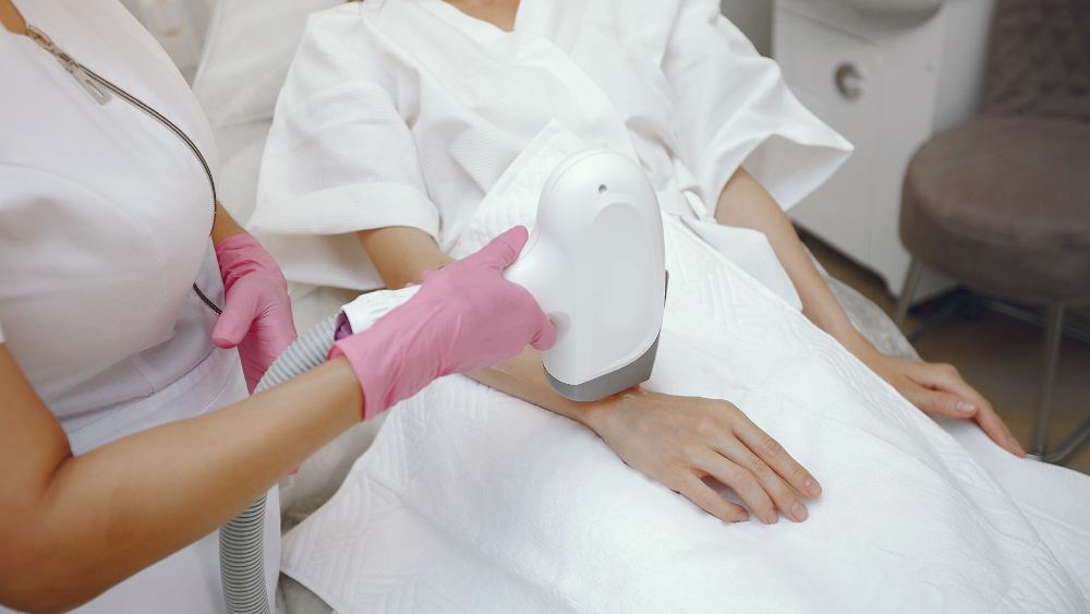 Woman under laser hair removal treatment